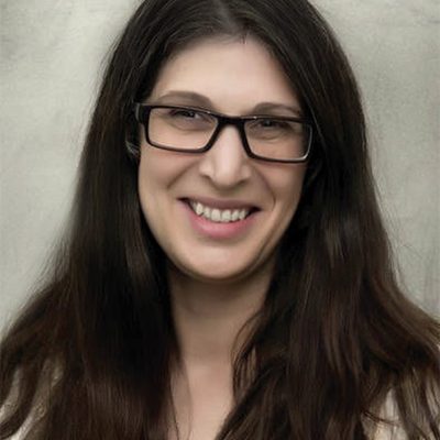 B.Balsamo-web Shoulder-up shot of a woman with long brown hair and glasses