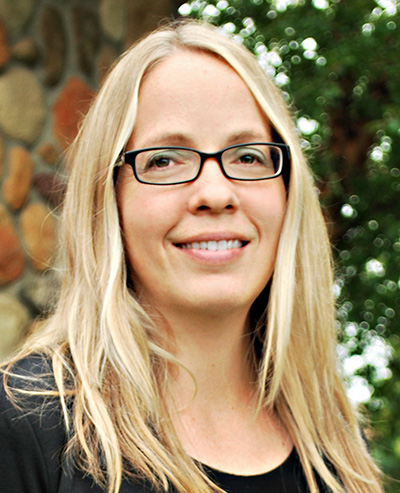 JWilliams_web Blonde woman with long hair and glasses