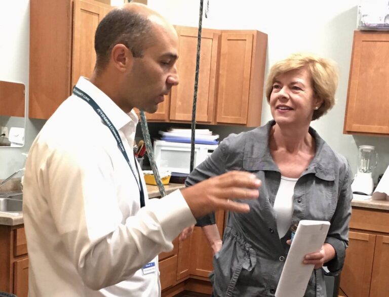 Tammy Baldwin talking with Jason Akl