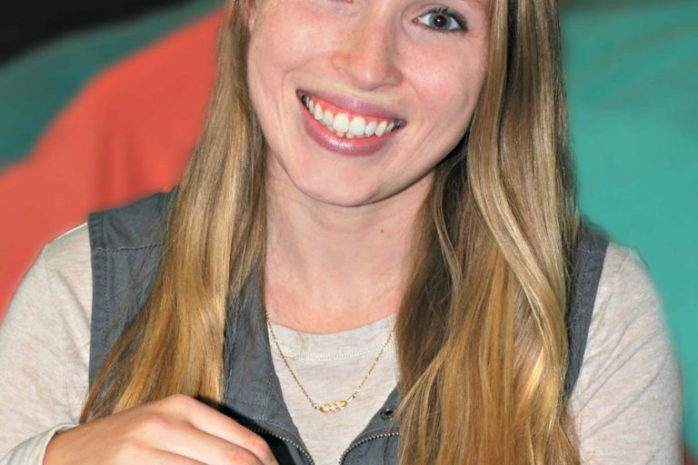 Woman smiling with long blonde hair