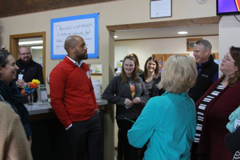 Mandela Barnes speaking with staff members in clinic lobby