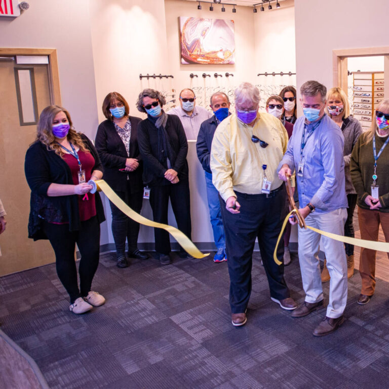 DSC_5400 Staff members watching ribbon be cut at Downtown Ashland clinic in the Eye center