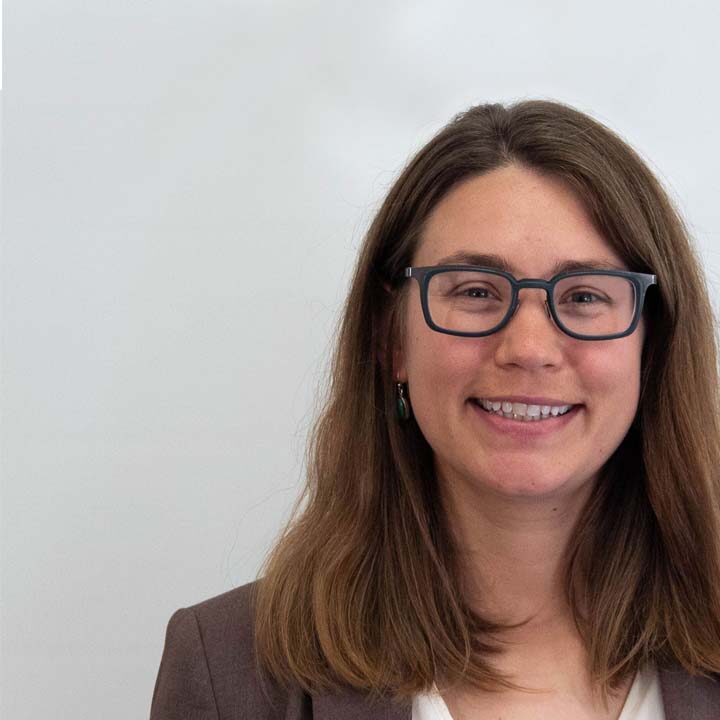 Josie-Runyan-Blog-Post Headshot of woman with brown medium length hair and black glasses