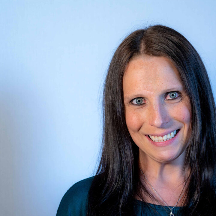 Amanda-Vitovsky-Joins-NorthLakes Headshot of woman with light blue eyes and dark long hair