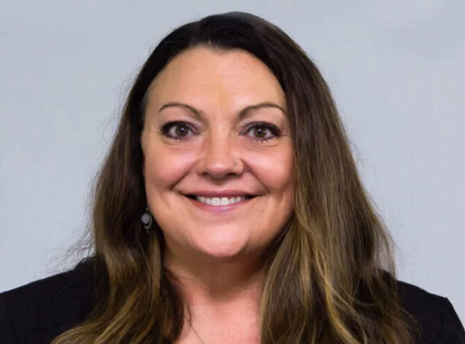 Patricia Kender Headshot of woman with long brown hair and brown eyes, smiling