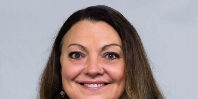 Patricia Kender Headshot of woman with long brown hair and brown eyes, smiling