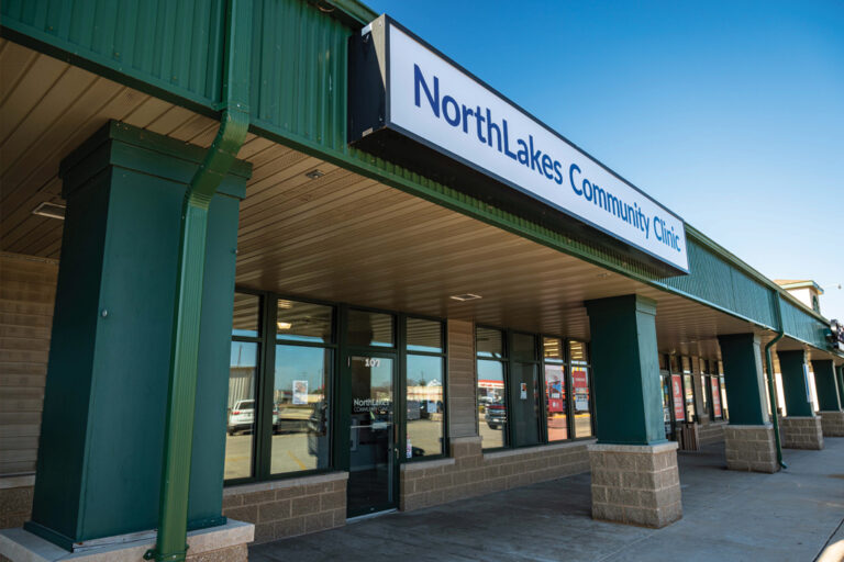 Exterior of street mall type of building with NorthLakes Community Clinic sign over it