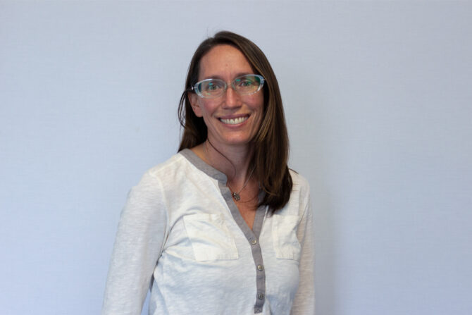 Angela-Vasser-Featured-Blog-Post-Photo Headshot of woman with medium length brown hair and glasses
