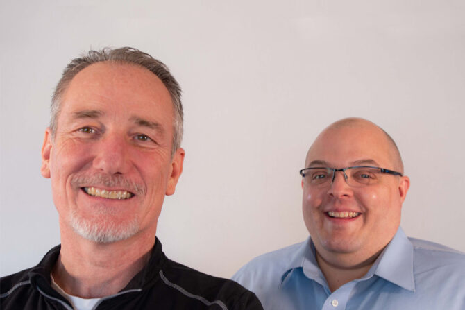 Two men smiling together