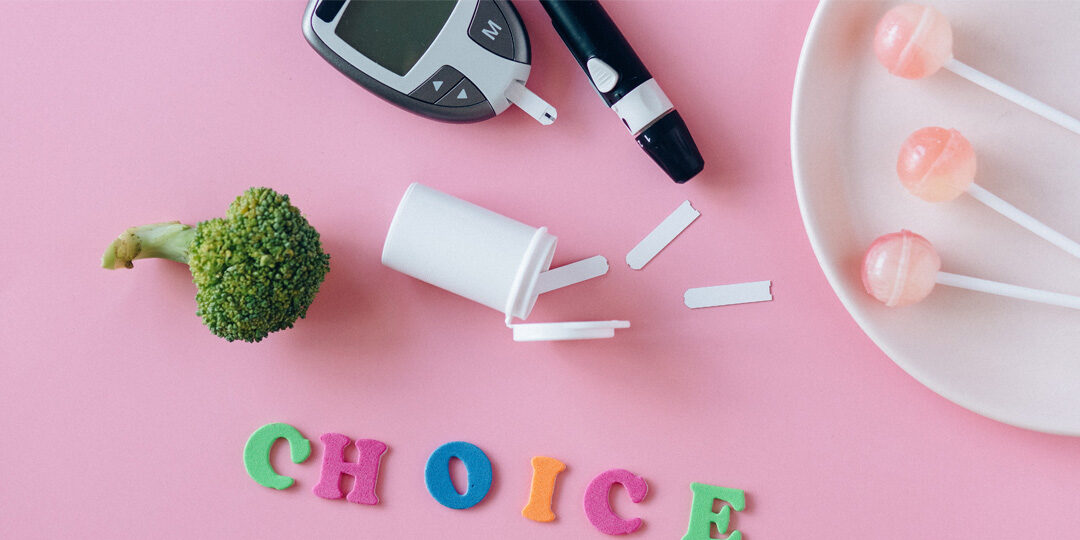 NorthLakes-Offers-Diabetes-Prevention-Program Broccoli, suckers, and glucose monitor on pink background with the word "choice"