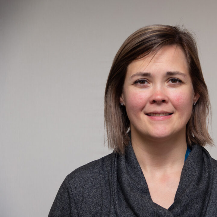 Tracy-Davis-Featured-Image Headshot of woman with short brown hair and gray top