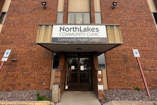 Rice-Lake-Clinic-Now-Offering-Pediatric-Therapies-Featured-Image Outside of brick building with NorthLakes Community Clinic sign on it