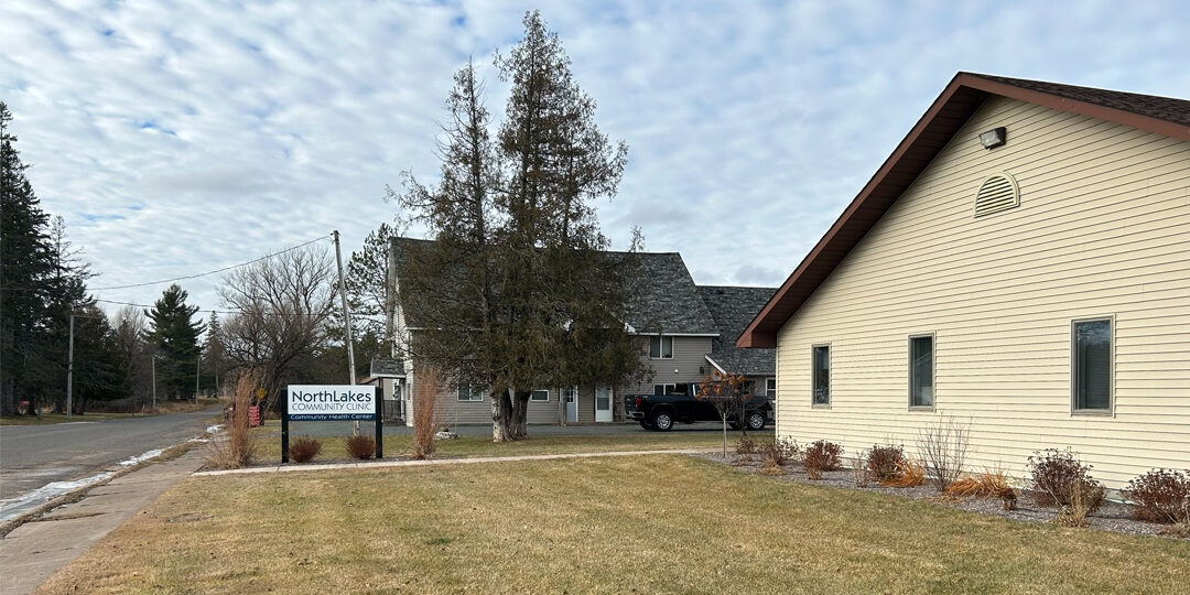 Poplar-Clinic-Featured-Image Yard with NorthLakes sign in it and beige colored building