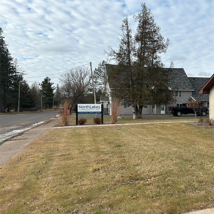 Poplar-Clinic-Featured-Image Yard with NorthLakes sign in it and beige colored building