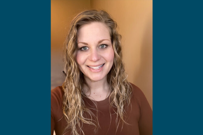 Michaela-Williams-Featured-Image Selfie of woman with blonde curly hair and brown long sleeve