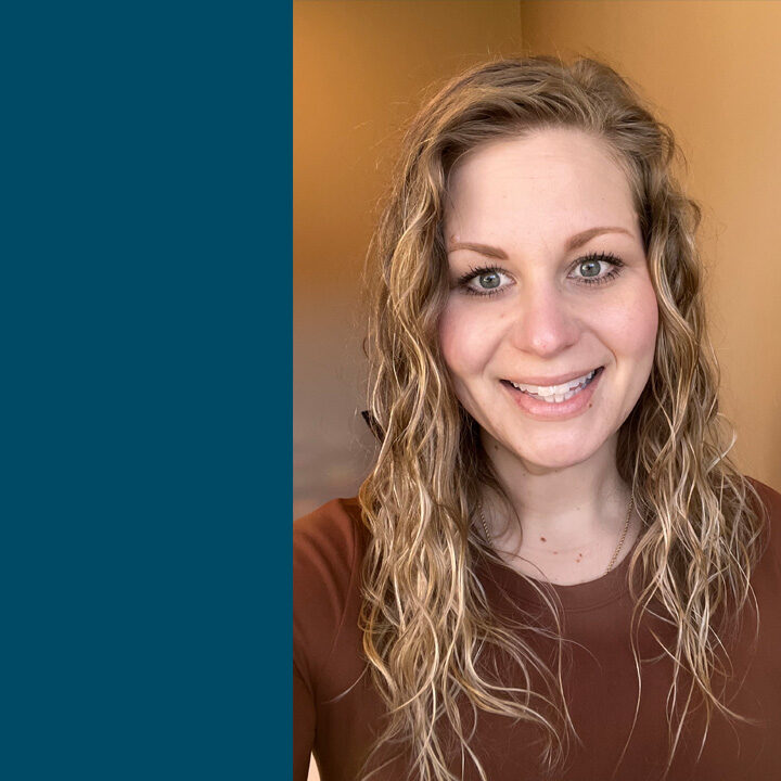 Michaela-Williams-Featured-Image Selfie of woman with blonde curly hair and brown long sleeve