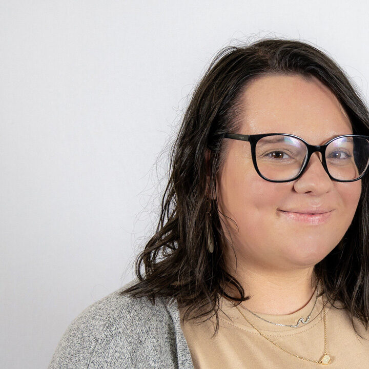 Elizabeth-Martinsen-Featured-Image Headshot of woman with short dark hair and glasses