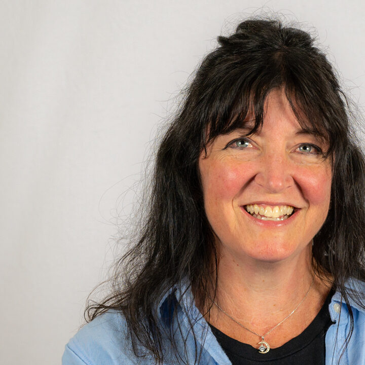 Melissa-Long-Featured-Image Headshot of woman with dark hair half up