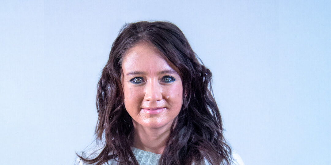 Kelly-Martin-Featured-Image Headshot of woman with very long dark hair and a cardigan