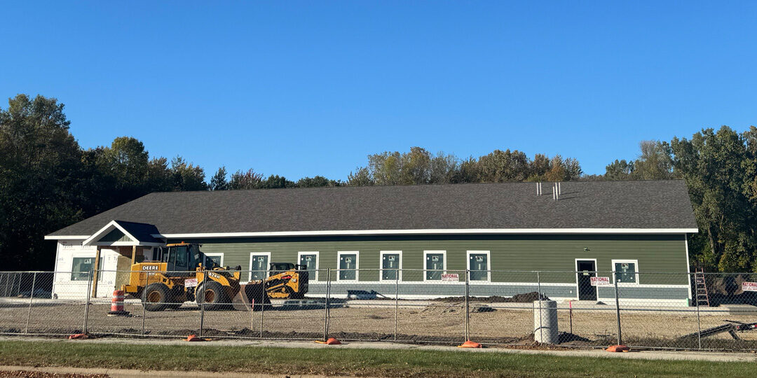 NorthLakes-Recieves-Multiple-Grants-To-Bridge-Gaps-In-Oconto Construction outside of large green building