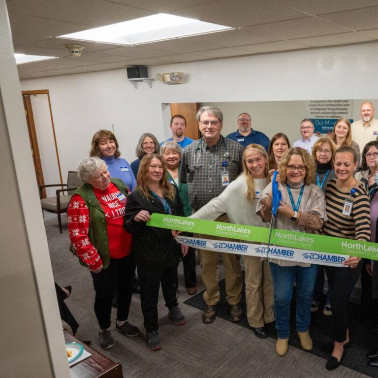 Augusta Ribbon Cutting group celebrating a ribbon cutting in a health clinic