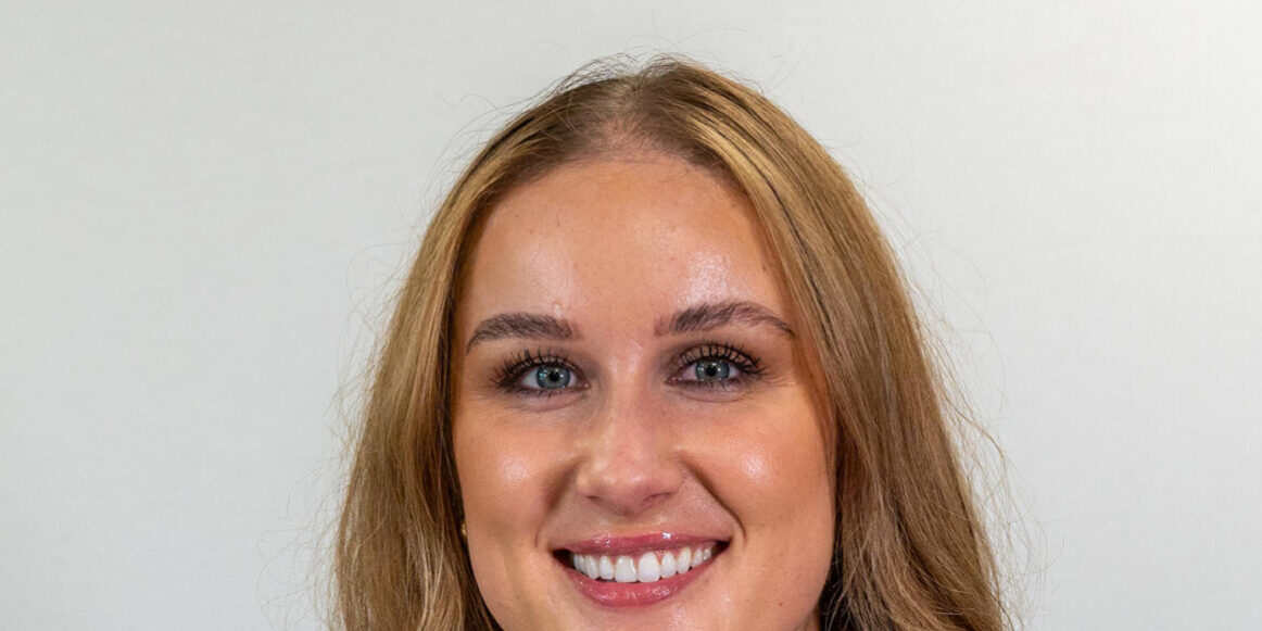 Woman with long blonde hair and light eyes