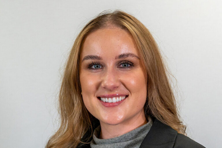 Woman with long blonde hair and light eyes