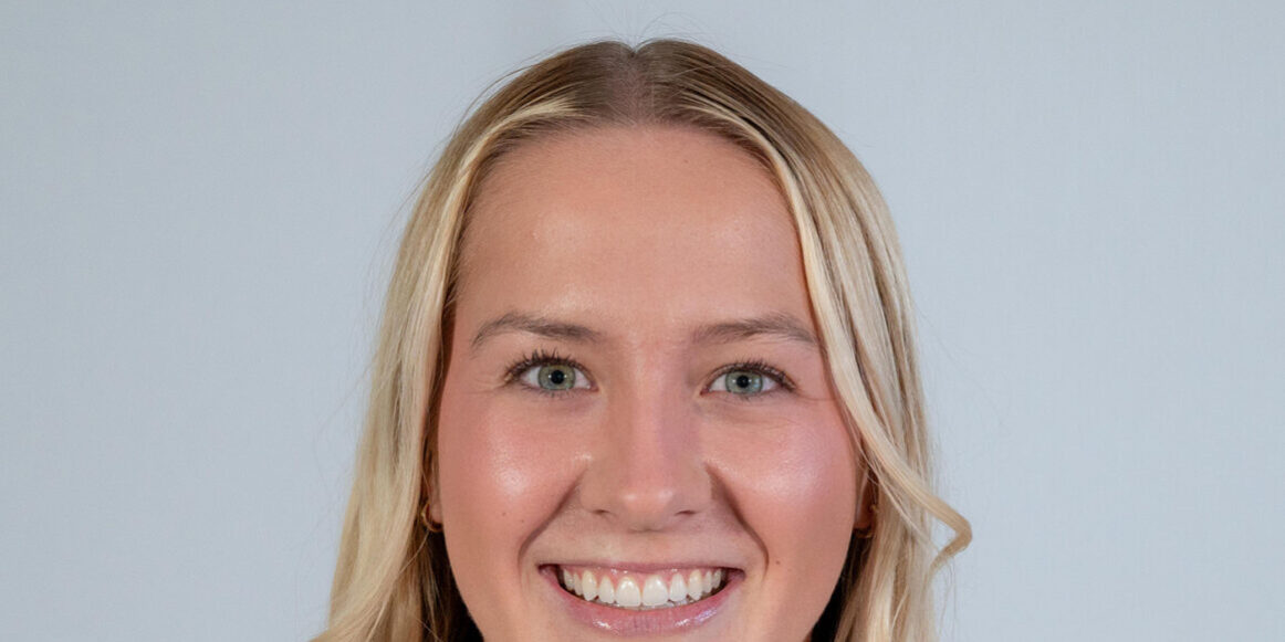 Headshot of woman with long blonde hair