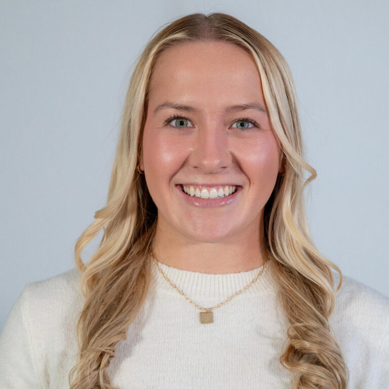 Headshot of woman with long blonde hair
