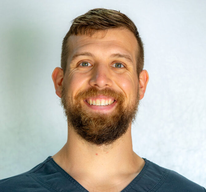 Man with brown short hair and beard