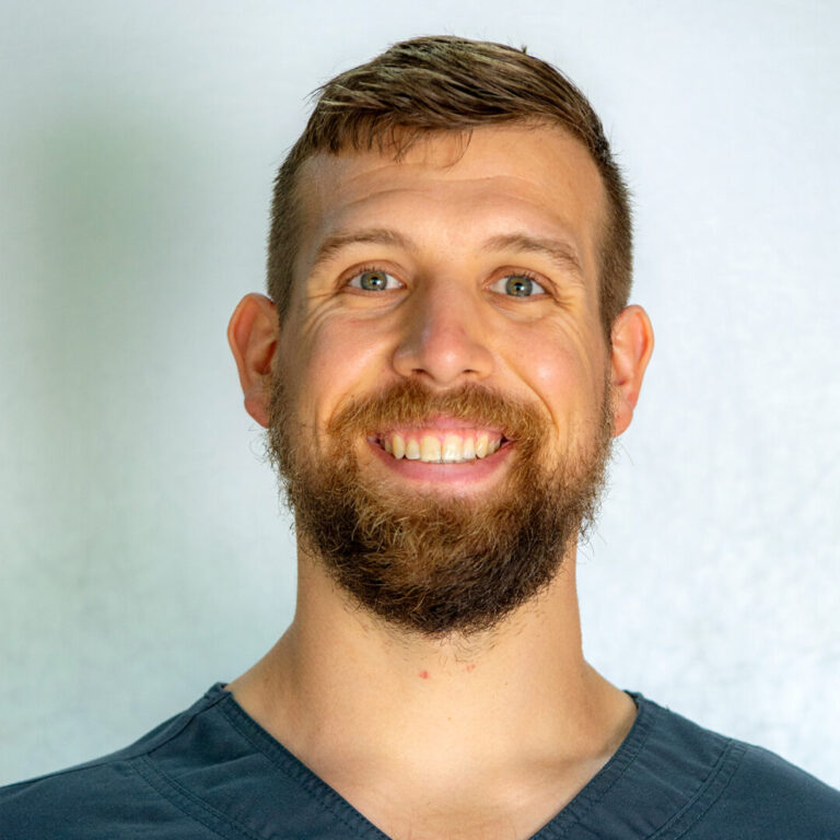 Man with brown short hair and beard