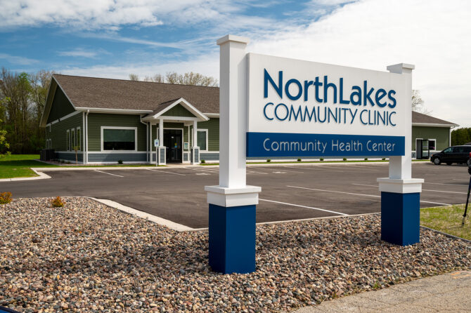 Green building with NorthLakes Community clinic sign in front