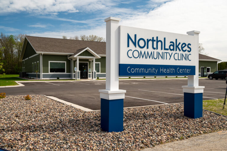 Green building with NorthLakes Community clinic sign in front