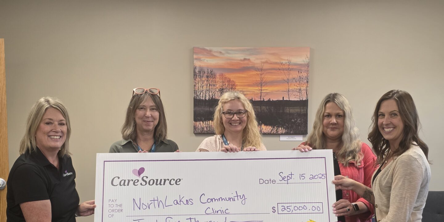 Caresource2 group of women holding large check