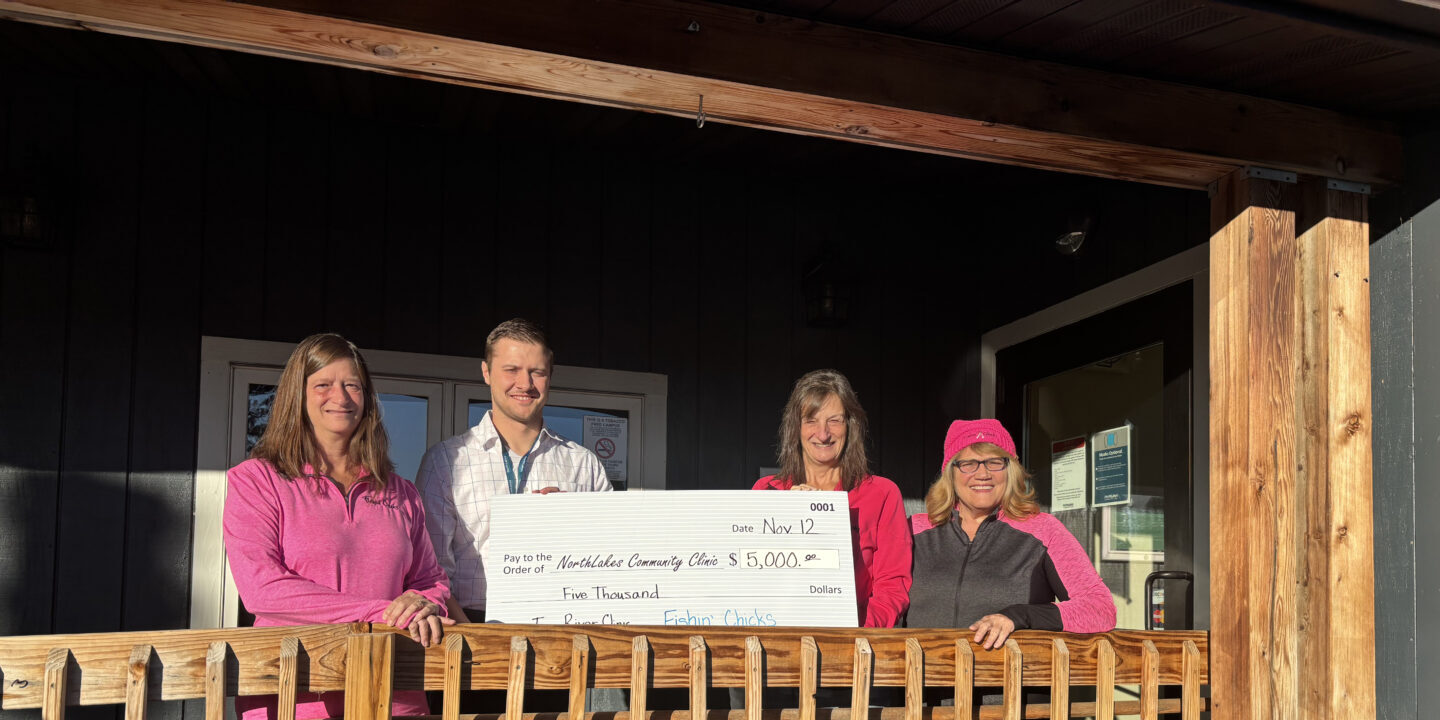 NorthLakes-Fishin-Chicks-IR25-2 group holding check on front porch