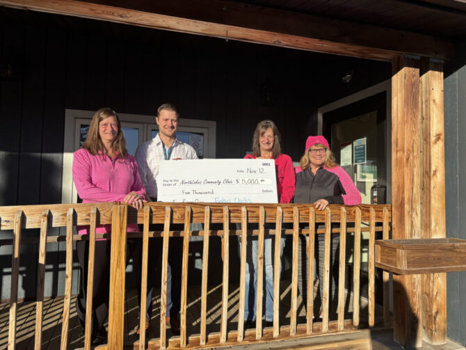 NorthLakes-Fishin-Chicks-IR25-2 group holding check on front porch